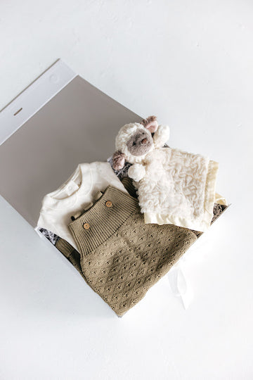 baby girl gift box with ivory onesie, sage green knit jumper and lamb security blanket