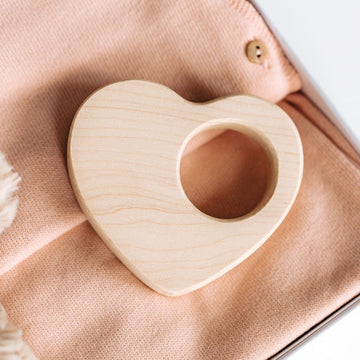 wood teething toy shaped like a heart